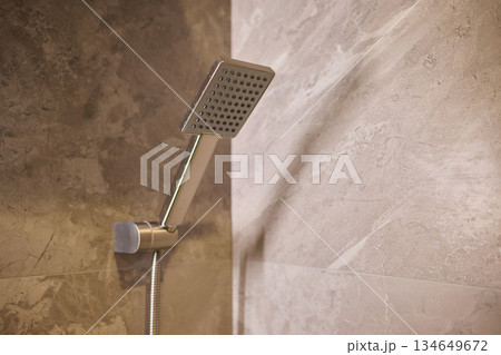 A modern, elegantly designed bathroom shower fixture offers both style and functionality 134649672