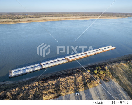 barges on the Ohio River at confluence with the Mississippi below Cairo, IL, November aerial view 134649797