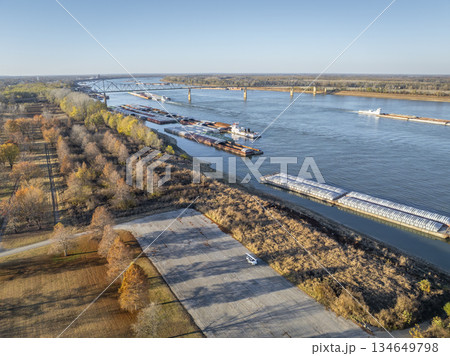 barges on the Ohio River at confluence with the Mississippi below Cairo, IL, November aerial view 134649798