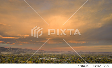 scenic sunrise cloudscape over Fort Collins and foothills of Rocky Mountains, fall scenery 134649799