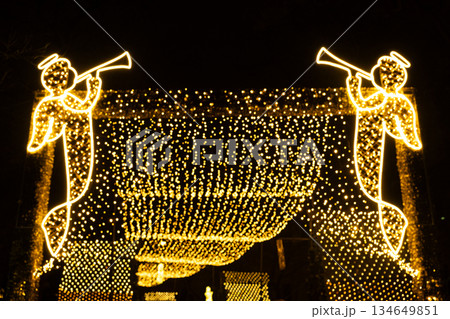 Golden Christmas Angel Light Installations Over a Festive Street Golden Christmas Angel Light Installations Over a Festive Street 134649851