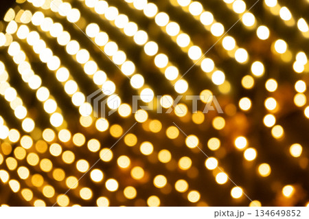 Blurred Yellow Fairy Lights Texture for Christmas Backdrop 134649852