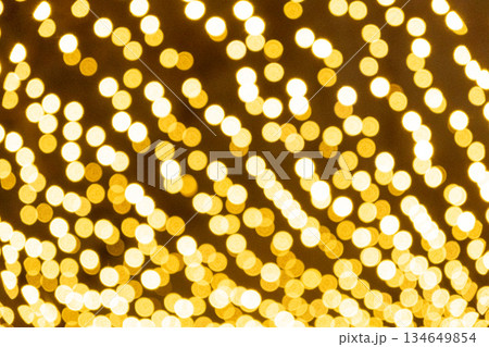 Blurred Yellow Fairy Lights Texture for Christmas Backdrop 134649854