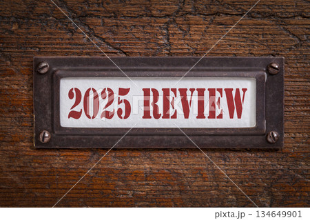 2025 review - a label on grunge wooden file cabinet. A passing year evaluation, summary and review concept. 134649901