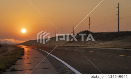 foggy sunrise over a highway in Nebraska Sandhills near Mullen 134649943