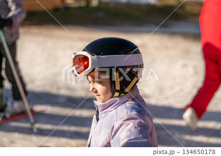 Ski coach giving a lesson to a child Ski coach giving a lesson to a child 134650178
