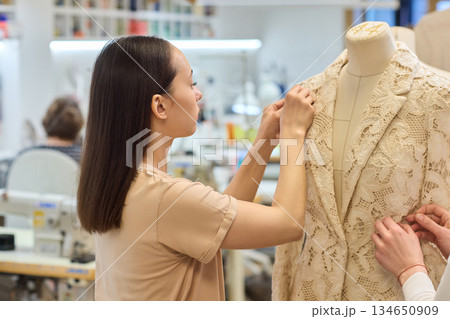 Fashion Design Tailoring a Beautiful Lace Garment on a Dress Form for Perfect Fit Fashion Design Tailoring a Beautiful Lace Garment on a Dress Form for Perfect Fit 134650909