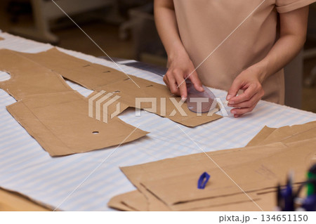 Tailoring Craftsmanship A Fashion Designer at Work Creating Beautiful Patterns with Precision Tailoring Craftsmanship A Fashion Designer at Work Creating Beautiful Patterns with Precision 134651150