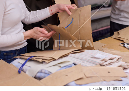 Tailoring Craftsmanship A Fashion Designer at Work Creating Beautiful Patterns with Precision Tailoring Craftsmanship A Fashion Designer at Work Creating Beautiful Patterns with Precision 134651591