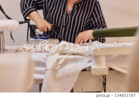 Ironing Clothes for a Neat, Tidy Finish at Home for Better Presentation and Appearance 134651597