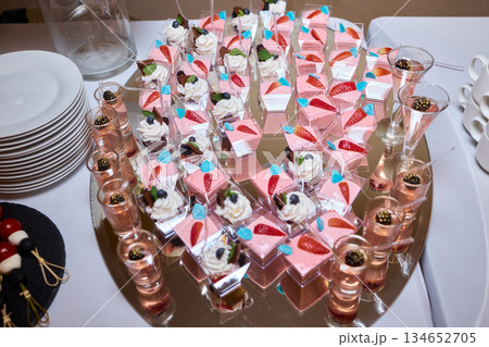 Luxurious setup with delicate details, Sophisticated arrangement featuring refined decor elements, Classy catering scene showcasing stylish glassware and decorative touches Luxurious setup with delicate details, Sophisticated arrangement featuring refined decor elements, Classy catering scene showcasing stylish glassware and decorative touches 134652705