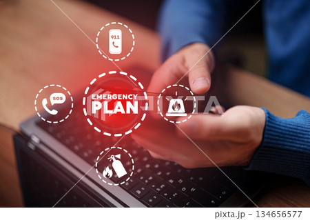 Creating an emergency plan using a laptop and smartphone at home Creating an emergency plan using a laptop and smartphone at home 134656577
