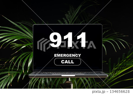 Emergency call on a laptop screen showing 911 during a crisis situation at home 134656628