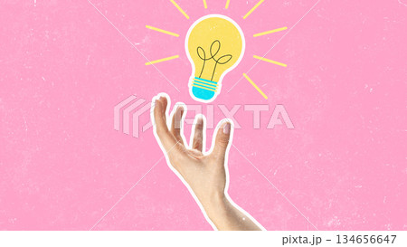 Creative hand reaching for a light bulb against a pink background Creative hand reaching for a light bulb against a pink background 134656647