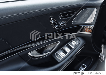 Detailed view of luxury car interior showcasing modern controls and design elements Detailed view of luxury car interior showcasing modern controls and design elements 134656729