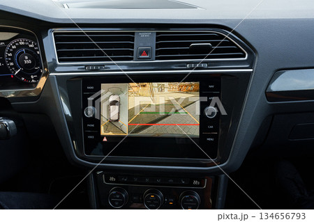 Display screen shows parking assist features in a modern vehicle dashboard Display screen shows parking assist features in a modern vehicle dashboard 134656793