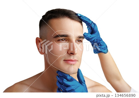 Man in clinic consulting for facial procedure with medical professional present Man in clinic consulting for facial procedure with medical professional present 134656890