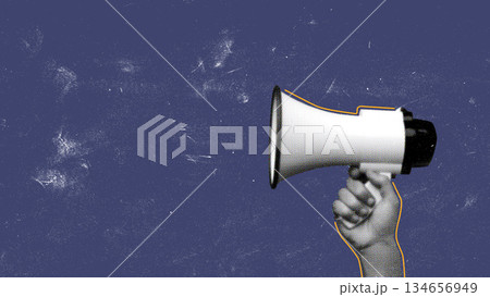 Hand holding a megaphone against a blue backdrop for communication and activism Hand holding a megaphone against a blue backdrop for communication and activism 134656949