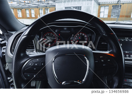 Dashboard view of a modern car in an urban setting during daylight Dashboard view of a modern car in an urban setting during daylight 134656986