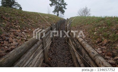 military training terrain, practice area with trenches structures, simulation zone for combat and excavation drills, training ground featuring earthworks and wooden military constructions 134657752
