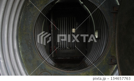 maintenance openings within fuselage leading to engine compartment routes, entry points inside aircraft fuselage facilitating service team inspection of engine ducting and wiring paths 134657763