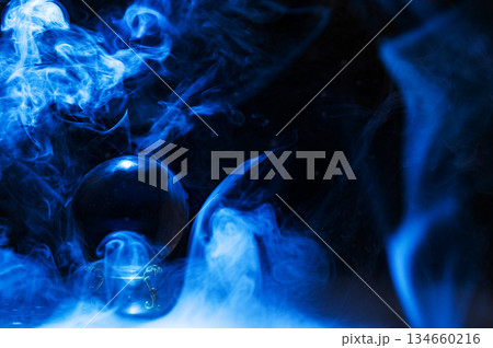 Crystal magical glass ball, mystical smoke and abstract light painting on dark background. Forecasting AI intuition, data flow, future technology. Crystal magical glass ball, mystical smoke and abstract light painting on dark background. Forecasting AI intuition, data flow, future technology. 134660216