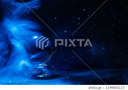 Crystal magical glass ball, mystical smoke and abstract light painting on dark background. Forecasting AI intuition, data flow, future technology. Crystal magical glass ball, mystical smoke and abstract light painting on dark background. Forecasting AI intuition, data flow, future technology. 134660223