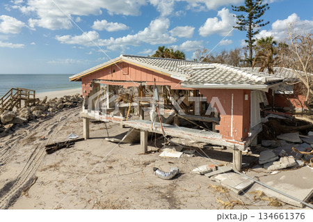 Ruined buildings in need of demolition or repair. Storm surge water and wind damaged houses roof and collapsed walls after hurricane in Florida Ruined buildings in need of demolition or repair. Storm surge water and wind damaged houses roof and collapsed walls after hurricane in Florida 134661376