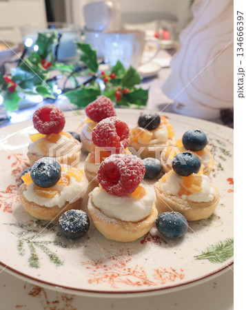 Dessert with powdered sugar, berries in shortcrust pastry baskets. Homemade healthy food. Holidays and desserts. Dessert with powdered sugar, berries in shortcrust pastry baskets. Homemade healthy food. Holidays and desserts. 134666397