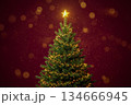 Christmas tree with a star on top and garlands against a bright burgundy background, sparkles of solute falling around the tree, a Christmas and New Year's card 134666945