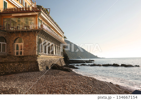 Stone building, construction on the seashore. Traditional Italian architecture. Nature on a sunny day. Background for design. 134667154