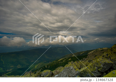 Beautiful clouds over the mountains 134667328