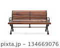 Vintage wooden park bench with ornate metal armrests 134669076