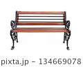 Ornate wooden park bench with decorative iron armrests and legs 134669078