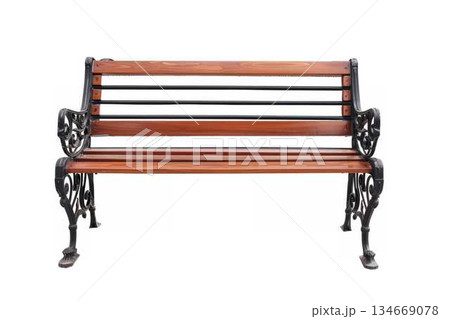 Ornate wooden park bench with decorative iron armrests and legs Ornate wooden park bench with decorative iron armrests and legs 134669078