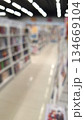 Blurry view of bookstore interior shelves with bright lighting 134669104