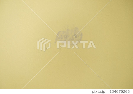 Plastered with gypsum hole in the yellow wall Plastered with gypsum hole in the yellow wall 134670266