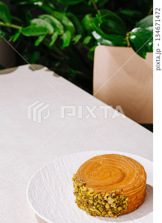 Delicious dessert on a stylish table surrounded by greenery in a 134671472