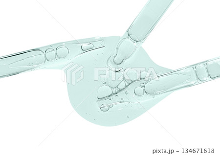 A sample of facial serum or gel or moisturizer with a pipette. Isolated on white. A sample of facial serum or gel or moisturizer with a pipette. Isolated on white. 134671618