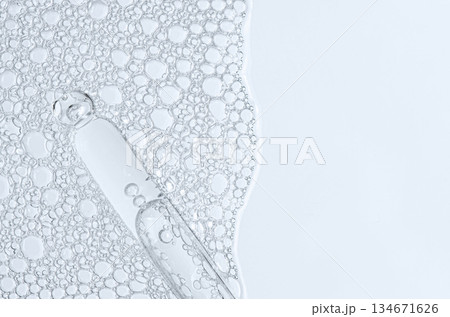 The texture of the foam of shower gel or soap suds or shaving foam. Macrophotography. Copy space 134671626