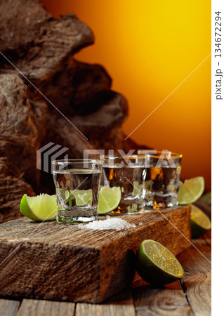 Tequila with salt and lime slices. 134672294