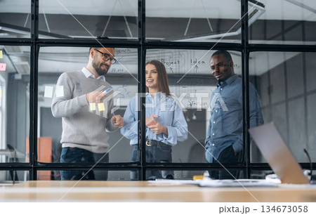 Tactics, planning the job. Professional workers are in the modern office together 134673058