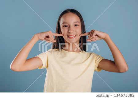 Young girl is against background 134673392