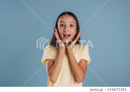 Surprised, shocked. Young girl is against background 134673393
