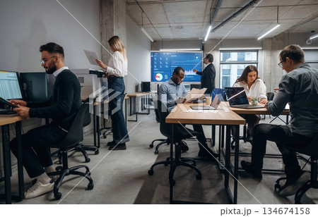 People are busy. Group of office workers are indoors together 134674158