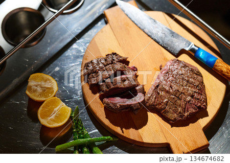 Family shares a meal of grilled meat and vegetables during iftar gathering in Ramadan evening Family shares a meal of grilled meat and vegetables during iftar gathering in Ramadan evening 134674682