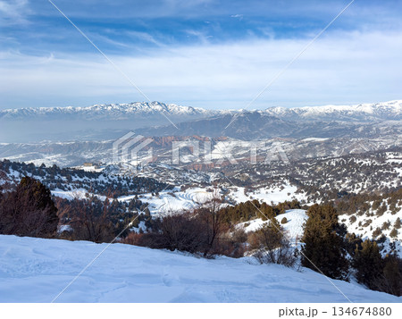 Panoramic view of snow-covered mountains at Amirsoy ski resort, Uzbekistan Panoramic view of snow-covered mountains at Amirsoy ski resort, Uzbekistan 134674880