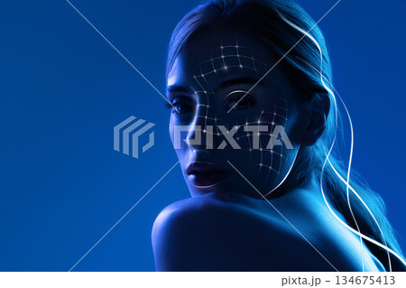 Futuristic artwork female portrait with facial scanning grid and technology mood 134675413