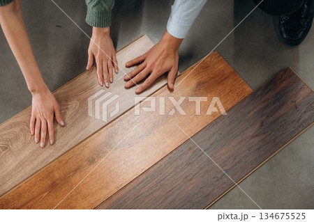 Choosing the parquet. Man and woman are in the hardware store 134675525
