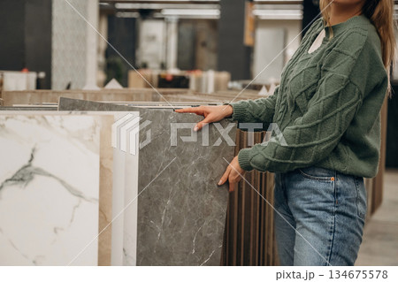 Close up view of woman that is in the hardware store 134675578